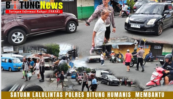 Satuan Lalulintas Polres Bitung humanis membantu meyeberangkan warga yang hendak berbelanja di Pasar